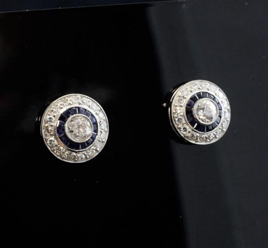 A pair of white gold, sapphire and diamond cluster target ear studs, dia. 0.5in.